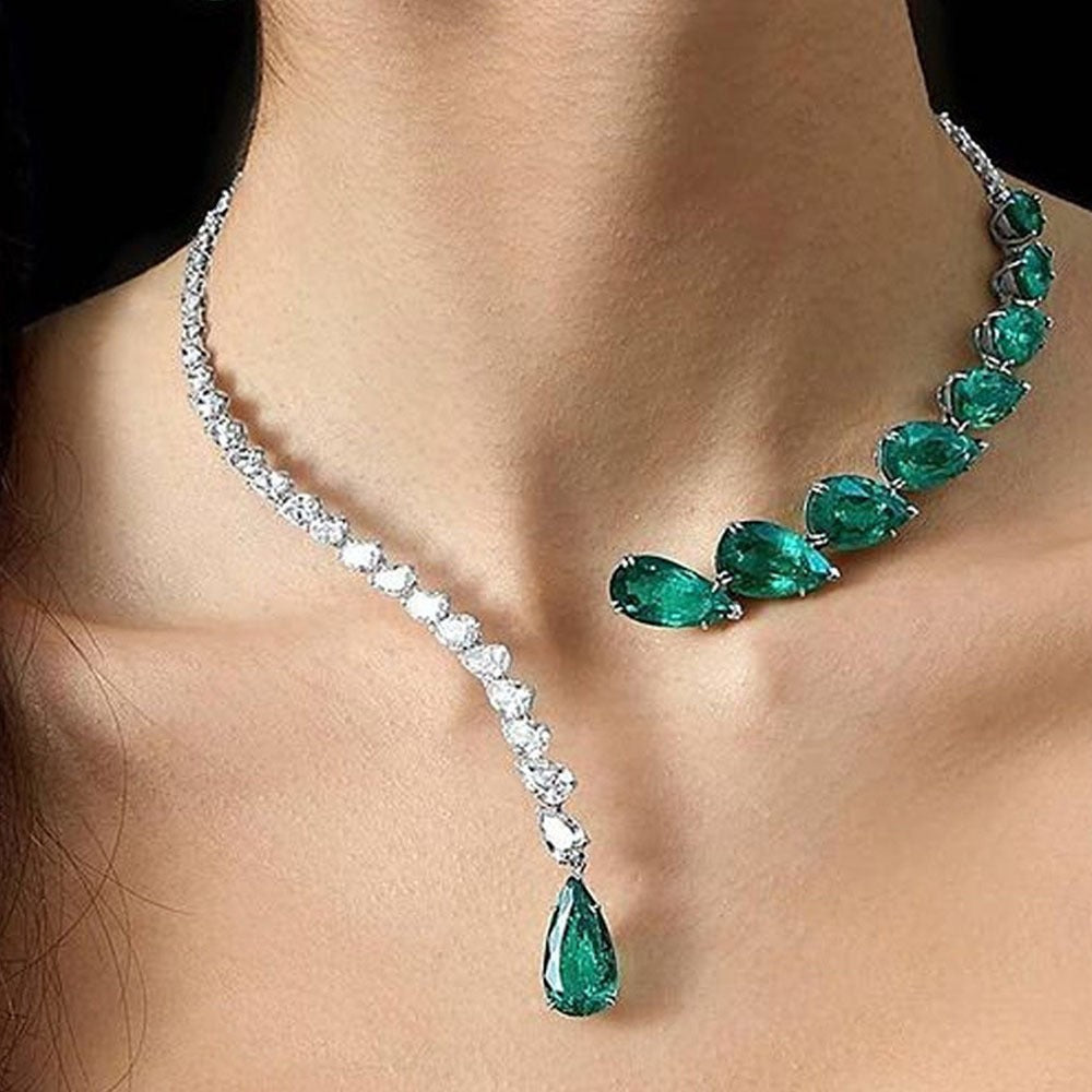 Lunéra de Paris asymmetric collar necklace with clear crystals and graduated pear-cut emerald green stones on silver