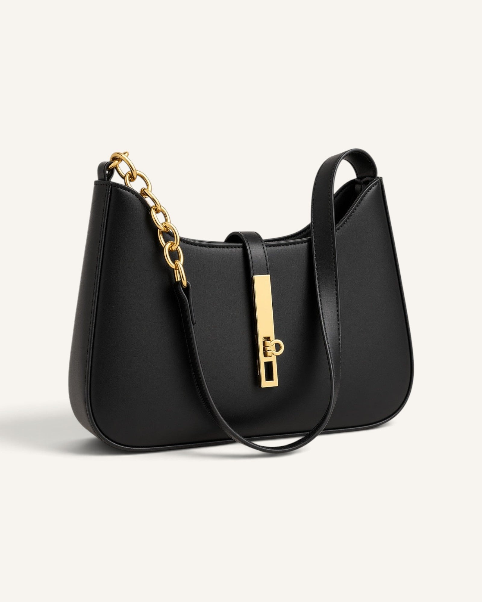 Lunéra de Paris black crescent shoulder bag with gold-tone chain strap and polished metallic clasp detail.