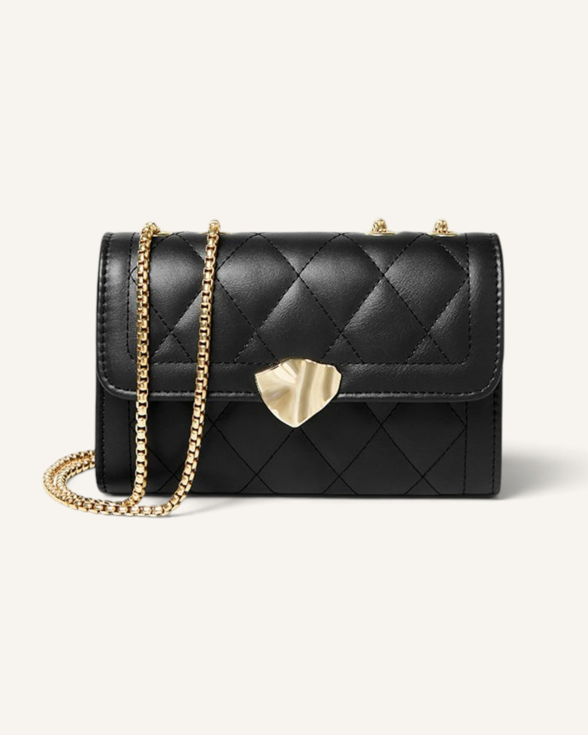 Lunéra de Paris black diamond-quilted shoulder bag with a gold chain strap and polished metallic clasp.