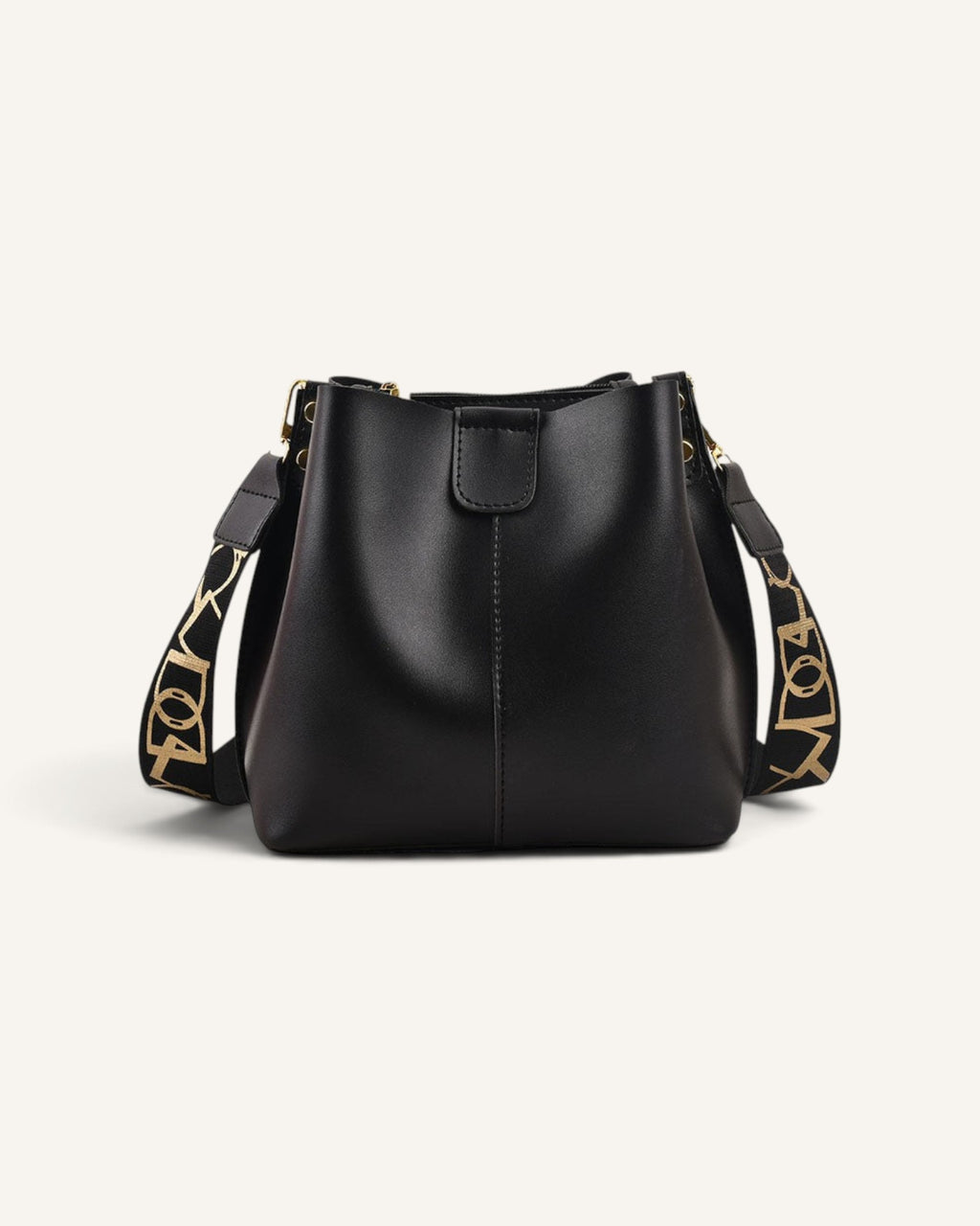 Lunéra de Paris black structured bucket bag with a wide patterned shoulder strap for a modern, polished look.