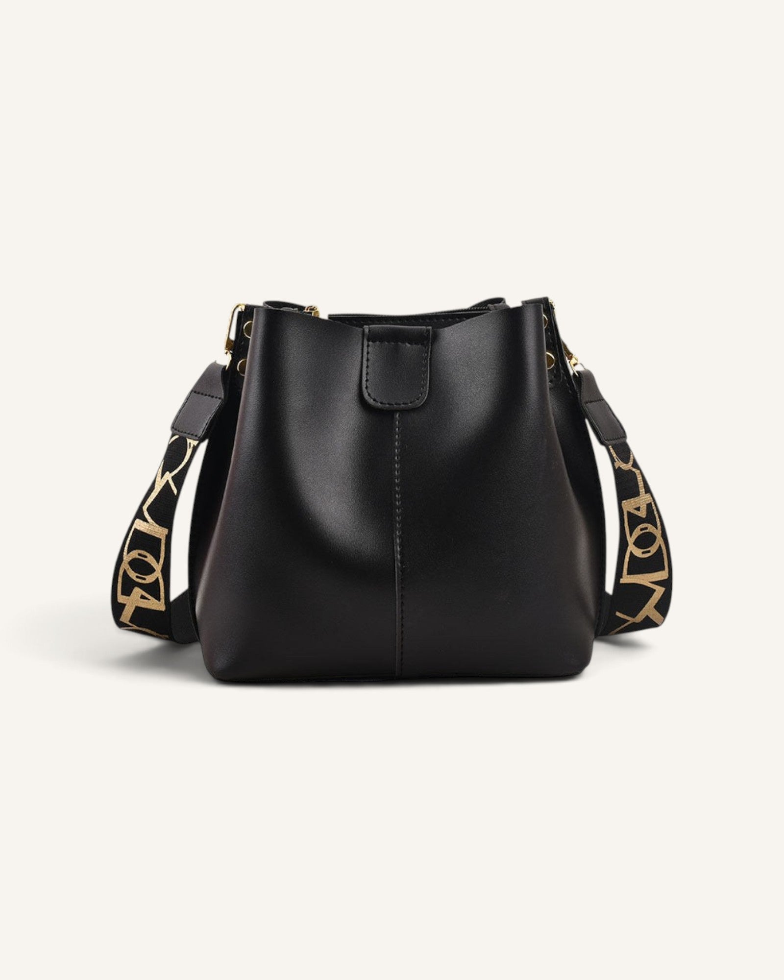 Lunéra de Paris black structured bucket bag with a wide patterned shoulder strap for a modern, polished look.