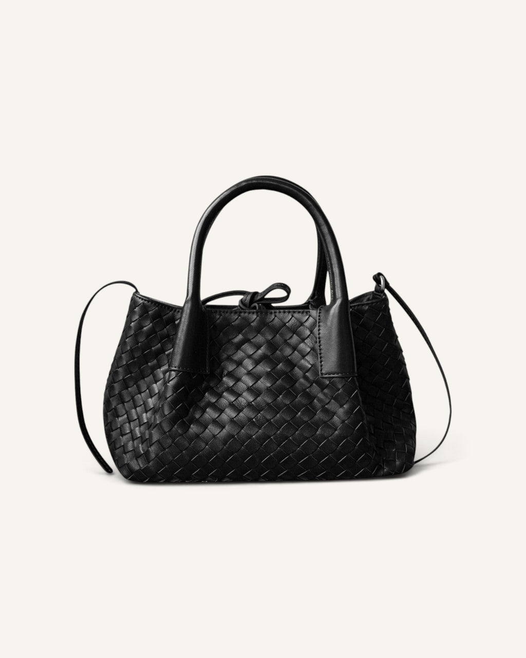 Lunéra de Paris black woven leather top-handle shoulder bag with a structured silhouette and adjustable strap.