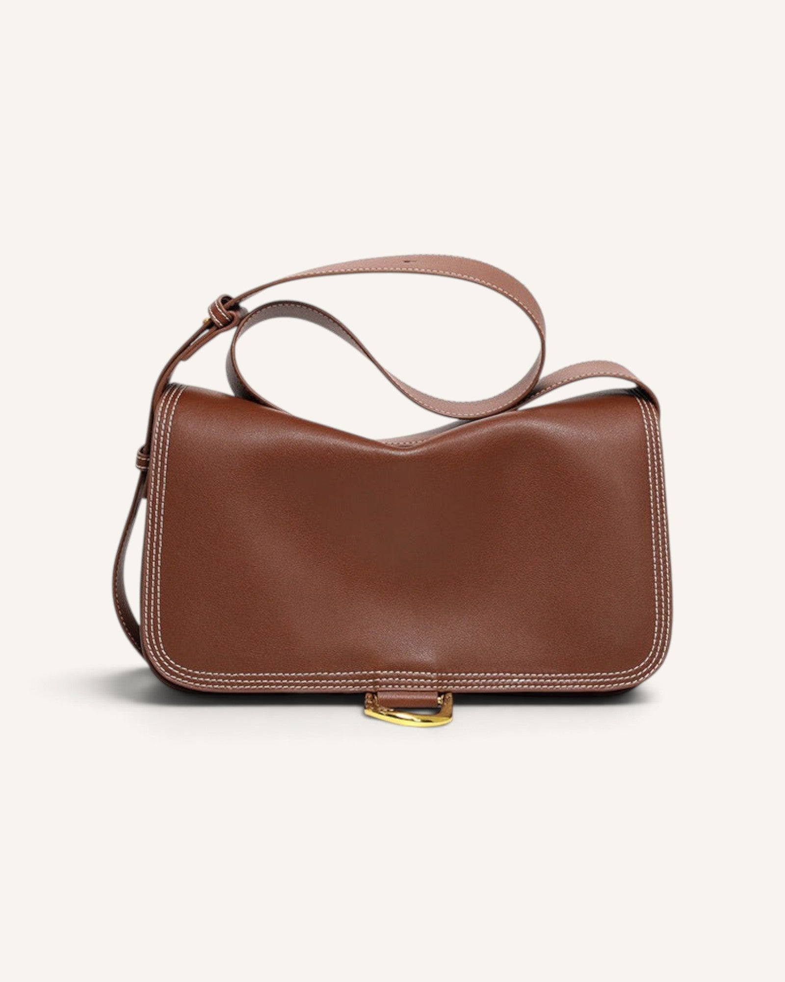 Lunéra de Paris brown leather shoulder bag with contrast stitching and gold hardware in a structured horizontal design