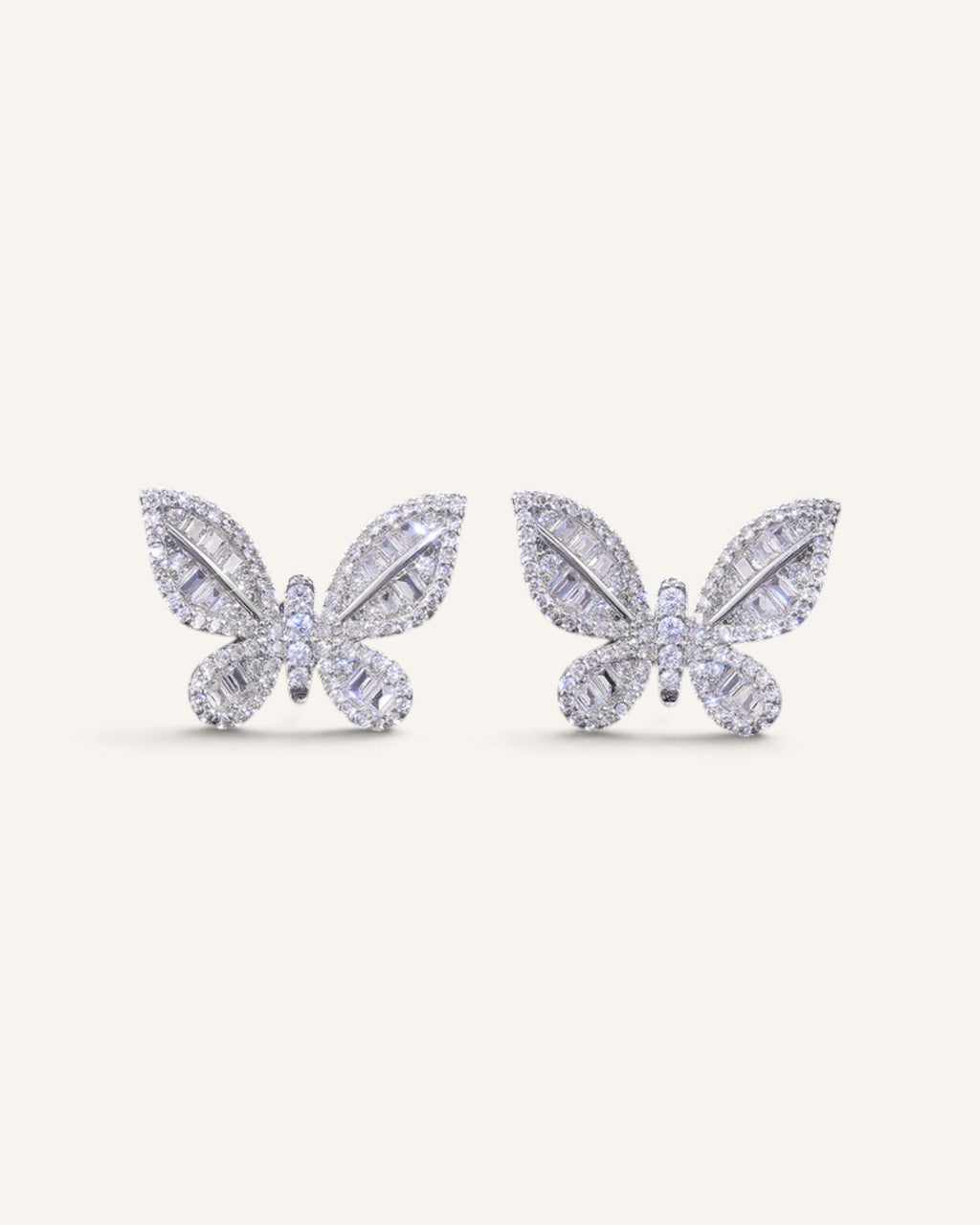 Lunéra de Paris butterfly stud earrings in silver-tone with baguette and round-cut zircon stones.