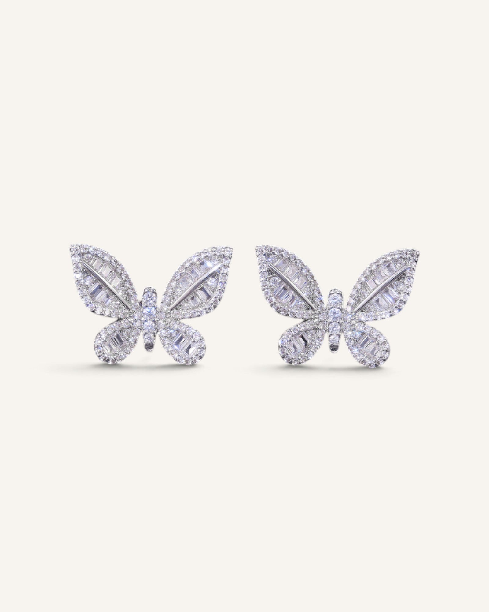 Lunéra de Paris butterfly stud earrings in silver-tone with baguette and round-cut zircon stones.