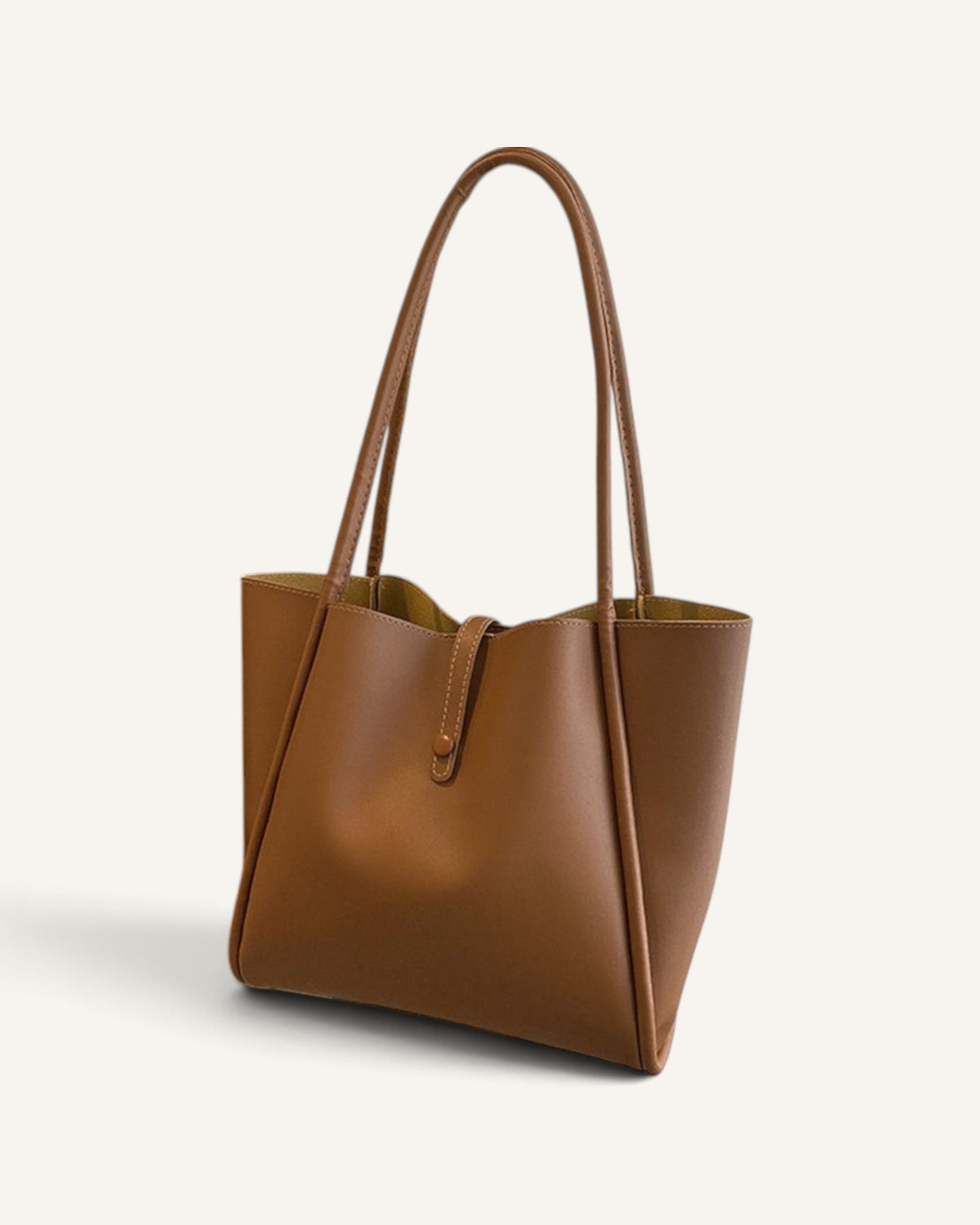 Lunéra de Paris cognac brown everyday shopper tote bag with slender shoulder straps and a soft-structured silhouette