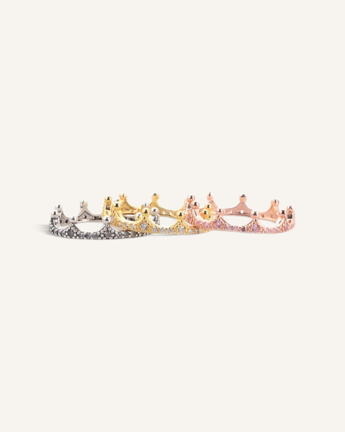 Lunéra de Paris crown motif rings in silver, gold, and rose gold with sparkling zircon stone accents