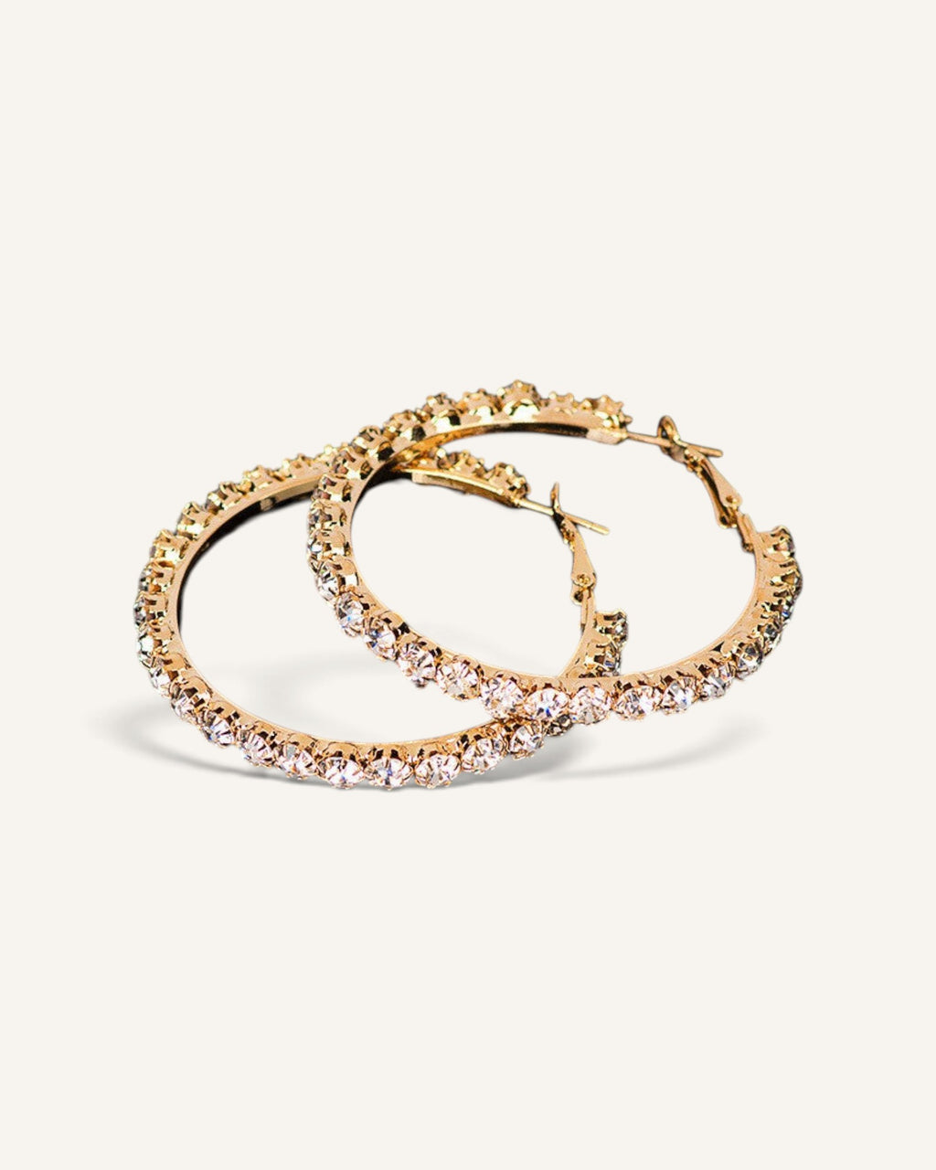 Lunéra de Paris gold hoop earrings featuring a circular silhouette with sparkling crystal embellishments