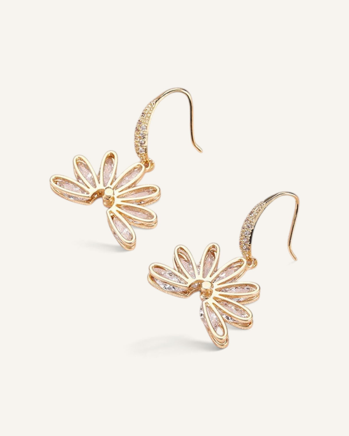 Lunéra de Paris gold tone drop earrings featuring a fan-inspired floral motif with sparkling crystal accents.