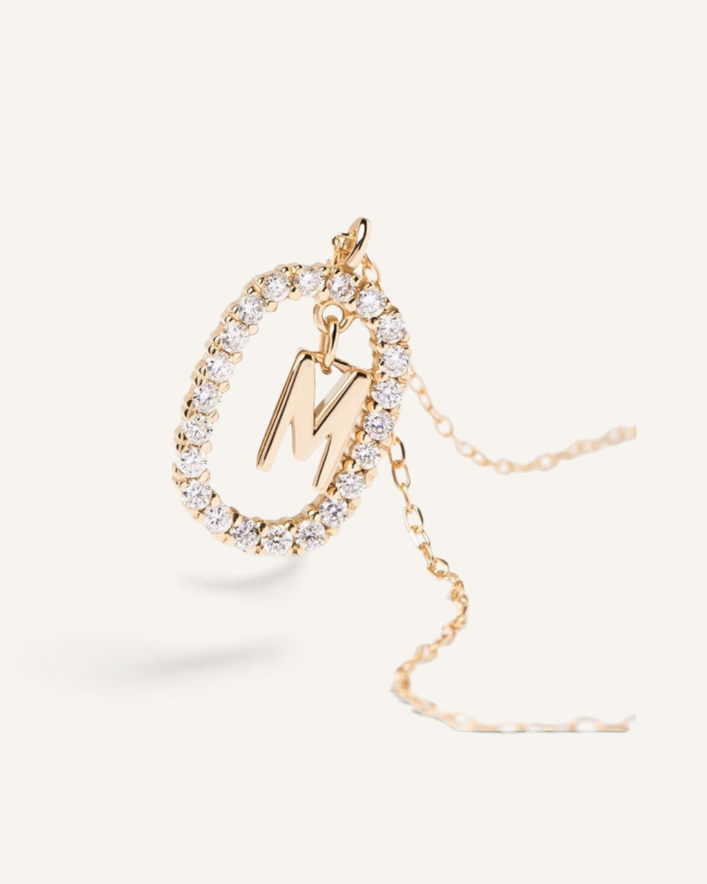 Lunéra de Paris gold-tone oval initial M pendant necklace with sparkling pavé crystals on a delicate chain