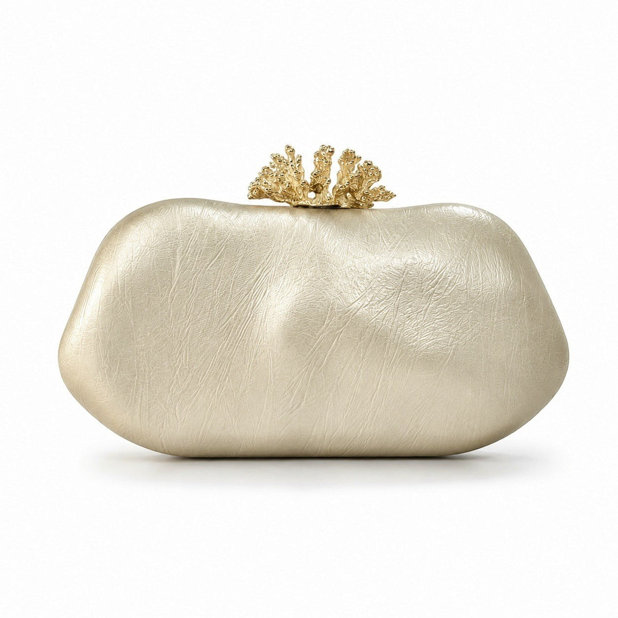 Lunéra de Paris gold oval evening clutch with a textured PU leather finish and a decorative coral-inspired clasp.