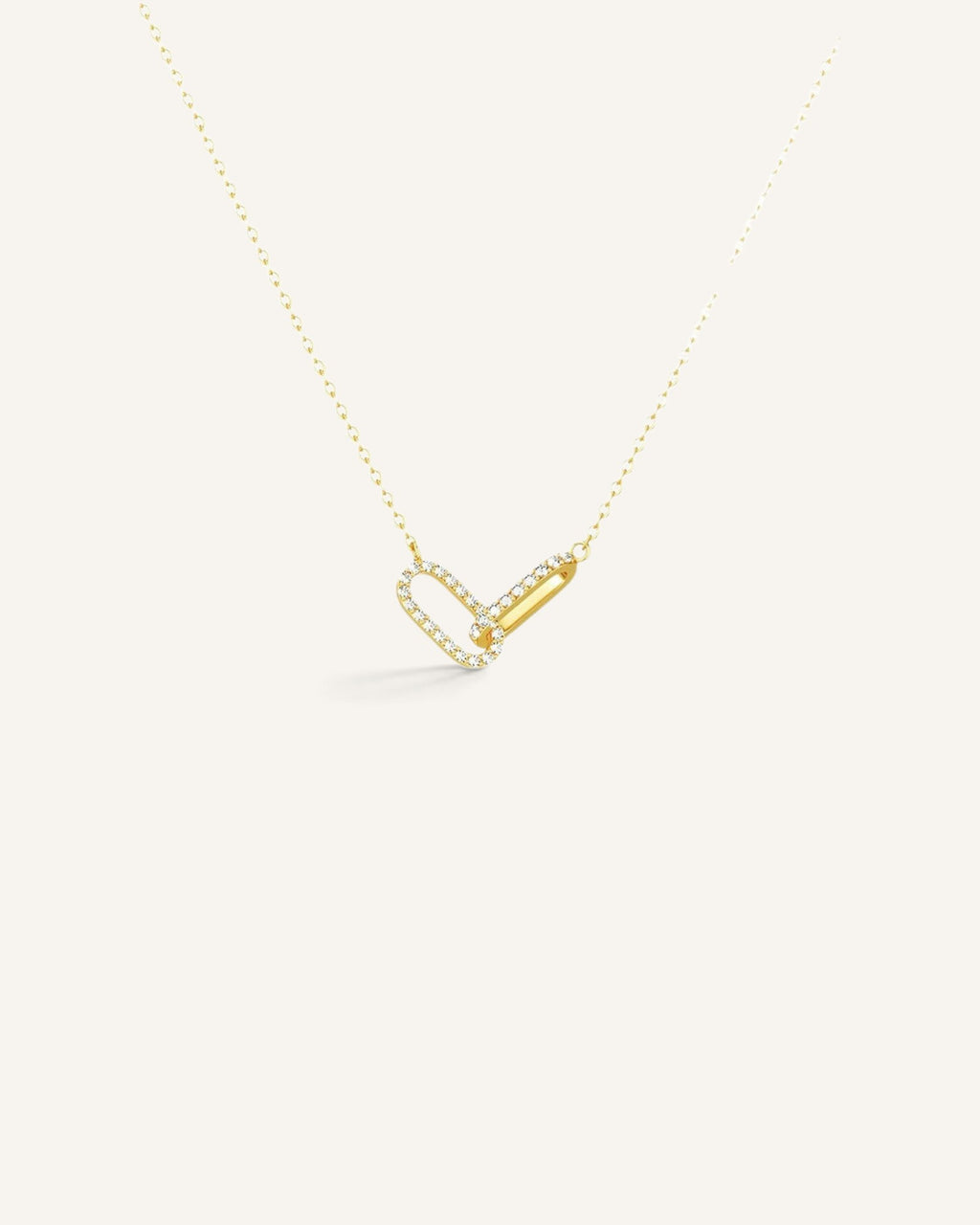 Lunéra de Paris gold interlocking link necklace featuring one pavé zircon link and one polished metal link.