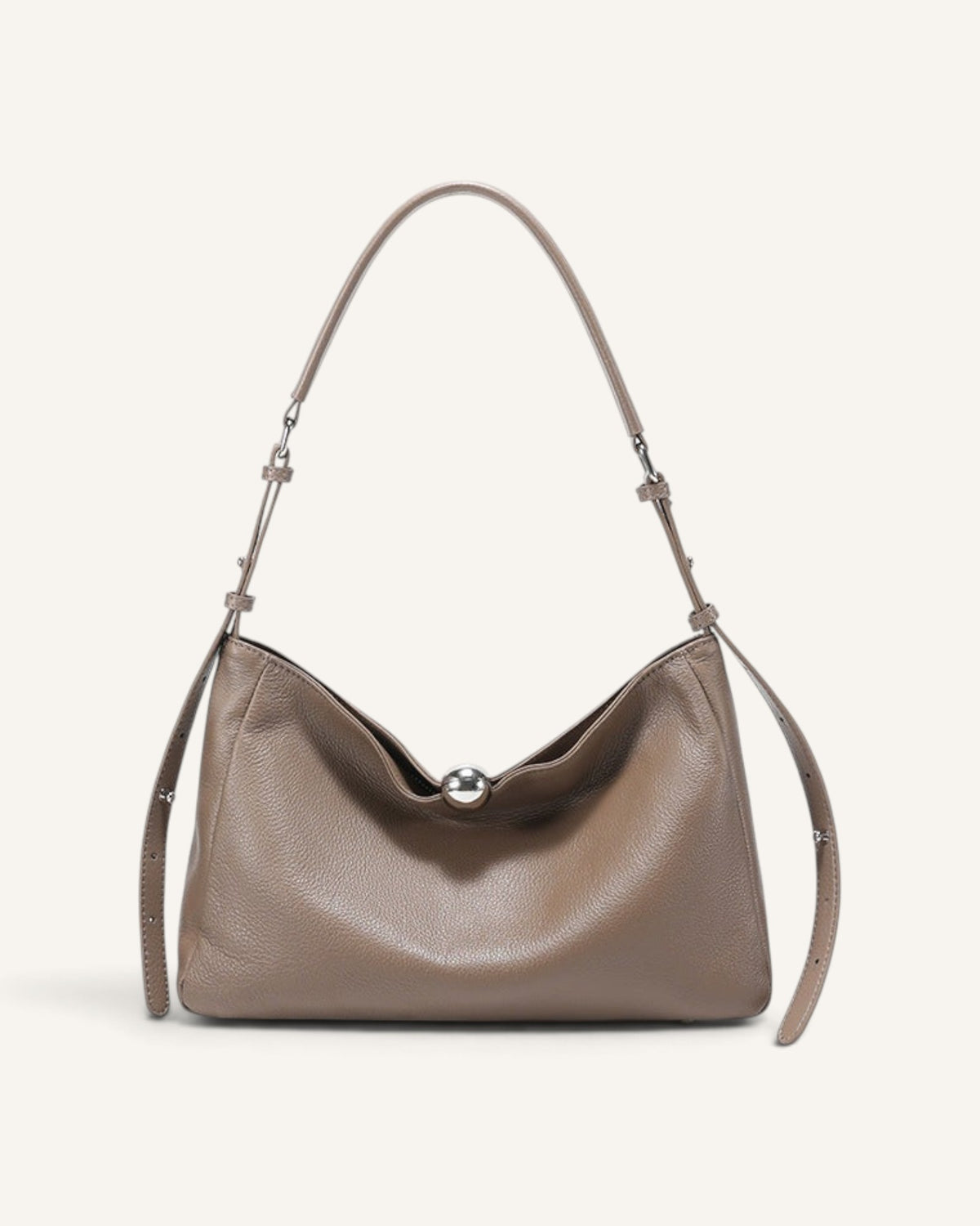 Lunéra de Paris slouchy khaki leather shoulder bag with a spherical metallic clasp and adjustable strap.