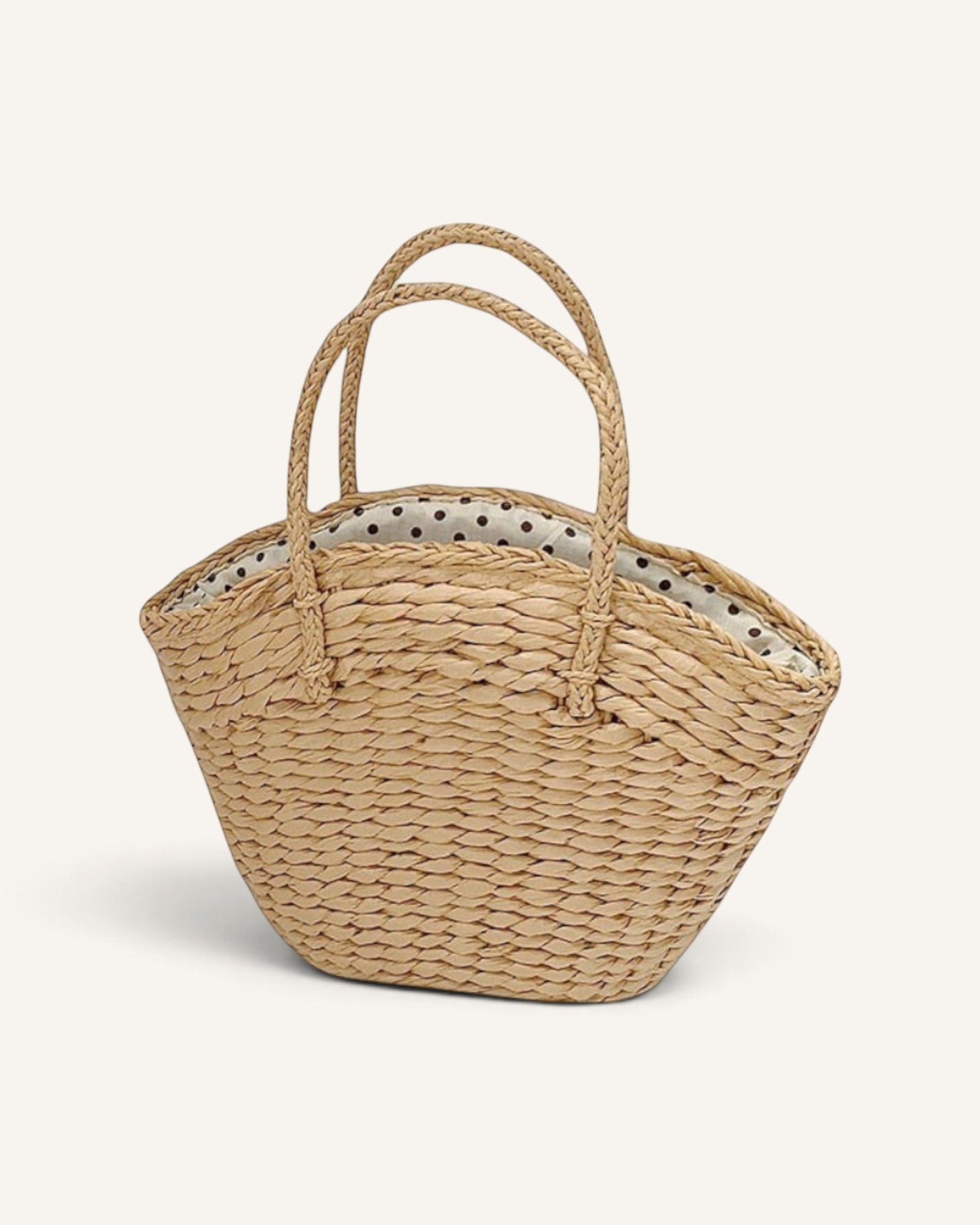 Lunéra de Paris khaki woven basket tote bag with braided handles and a polka-dot drawstring interior lining.