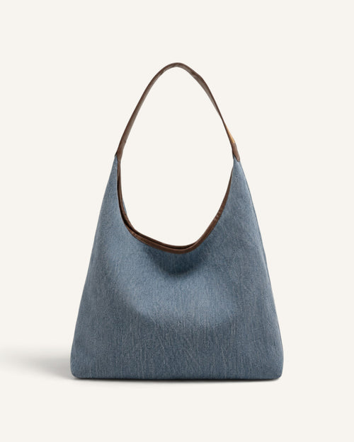 Lunéra de Paris light indigo denim canvas hobo shoulder bag with brown trim and slouchy silhouette