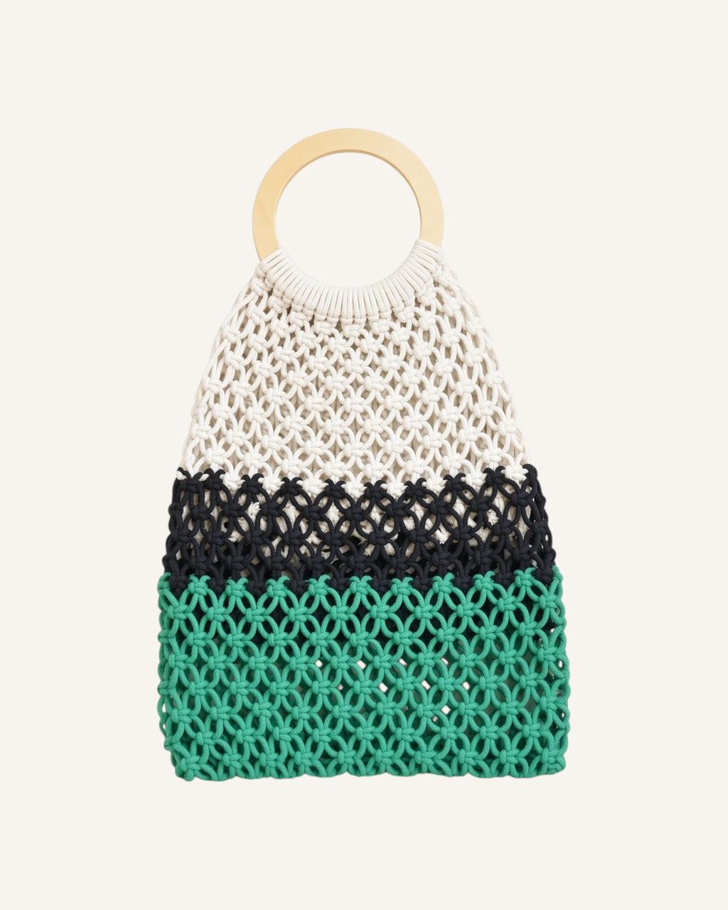 Lunéra de Paris macramé tote bag featuring a circular wooden handle and a tri-color woven pattern in cream, black, and green.