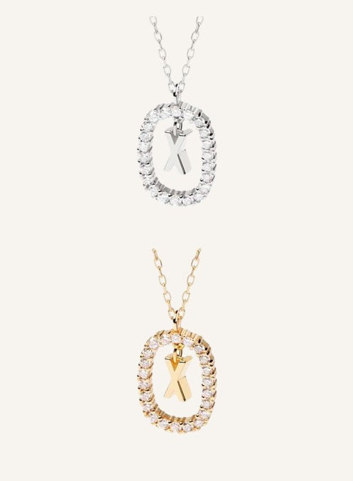 Lunéra de Paris pavé oval initial pendant necklaces in silver and gold tones with sparkling crystal accents.