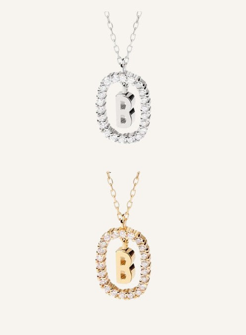 Lunéra de Paris gold and silver pavé oval initial pendant necklaces with letter B charms on delicate chains.