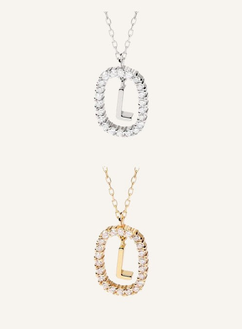 Lunéra de Paris pavé oval initial pendant necklaces in silver and gold tones with sparkling crystal accents.