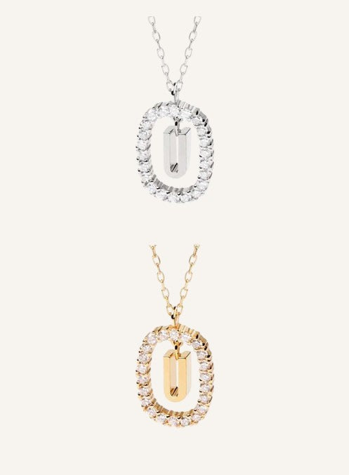 Lunéra de Paris pavé oval initial U pendant necklaces in gold and silver tones with delicate chains.