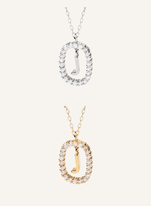 Lunéra de Paris pavé oval initial pendant necklaces in silver and gold tones with sparkling crystal accents.