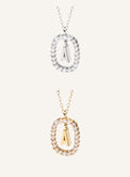 Lunéra de Paris pavé oval initial pendant necklace featuring a sparkling letter charm on a delicate chain.