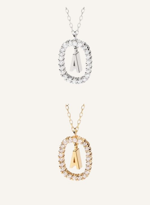 Lunéra de Paris pavé oval initial pendant necklace featuring a sparkling letter charm on a delicate chain.