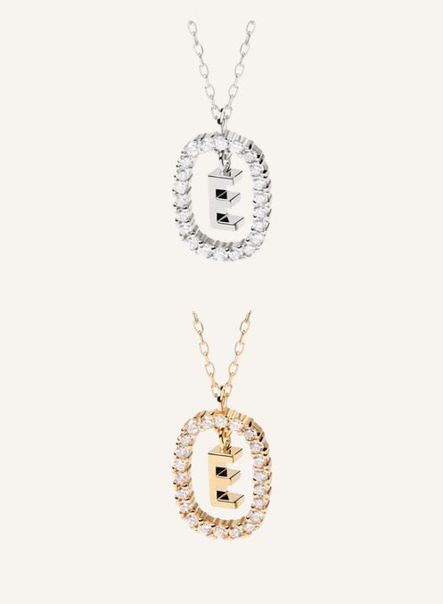 Lunéra de Paris pavé oval initial pendant necklace featuring a sparkling letter E charm on a delicate chain