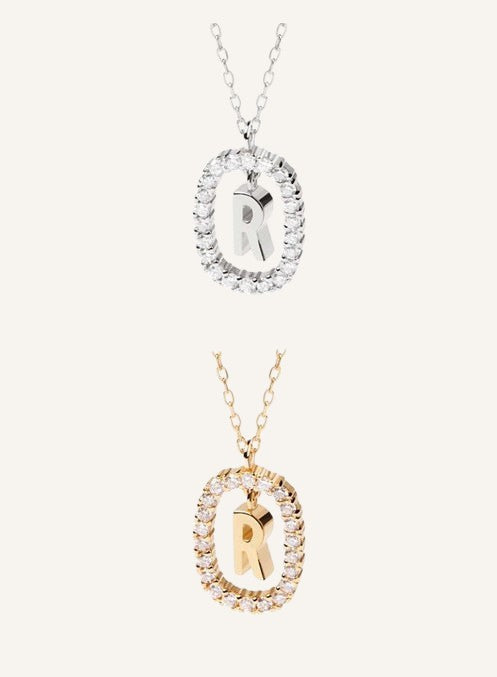 Lunéra de Paris gold and silver pavé oval initial R pendant necklaces with delicate chains.