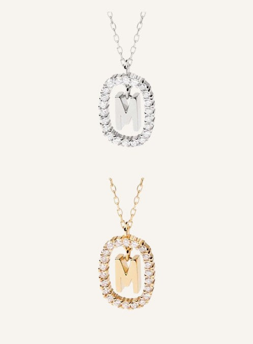 Lunéra de Paris pavé oval initial M pendant necklaces in silver and gold tones with delicate chain links.