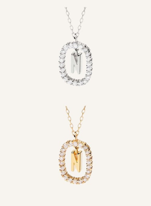 Lunéra de Paris pavé oval initial N pendant necklaces in silver and gold tones with delicate chains.