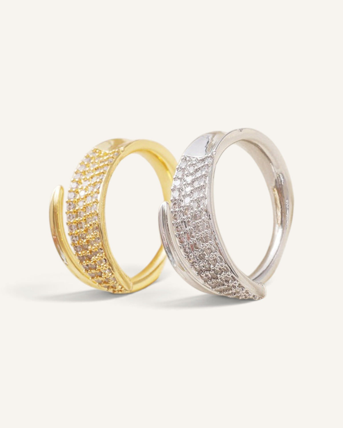 Lunéra de Paris gold and silver pavé wrap couple rings with textured open-ended design on a neutral background