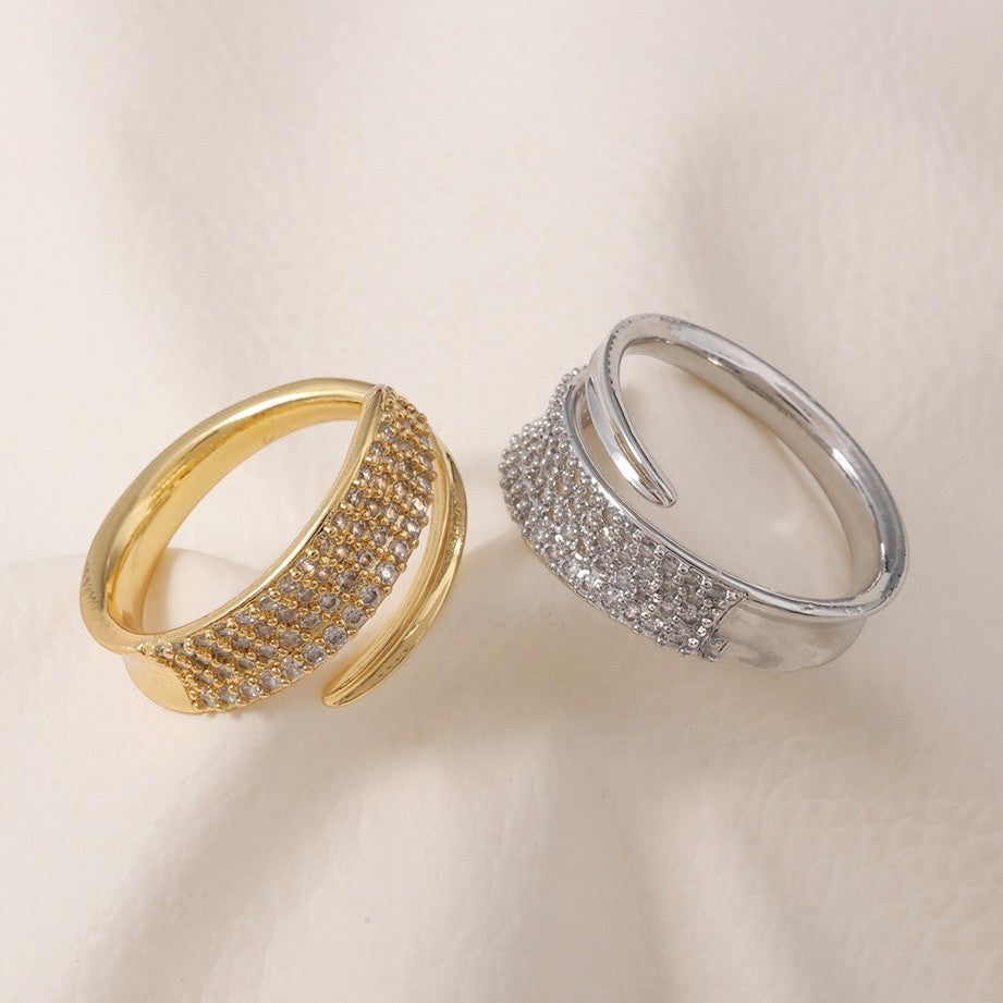 Lunéra de Paris gold and silver pavé wrap couple rings with textured open-ended design on a soft white fabric