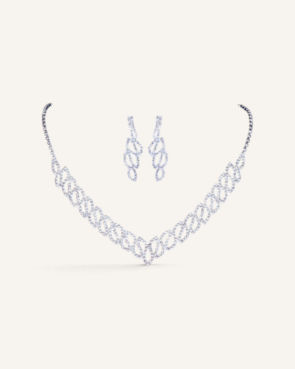 Lunéra de Paris silver V-silhouette jewelry set featuring a rhinestone necklace and matching drop earrings