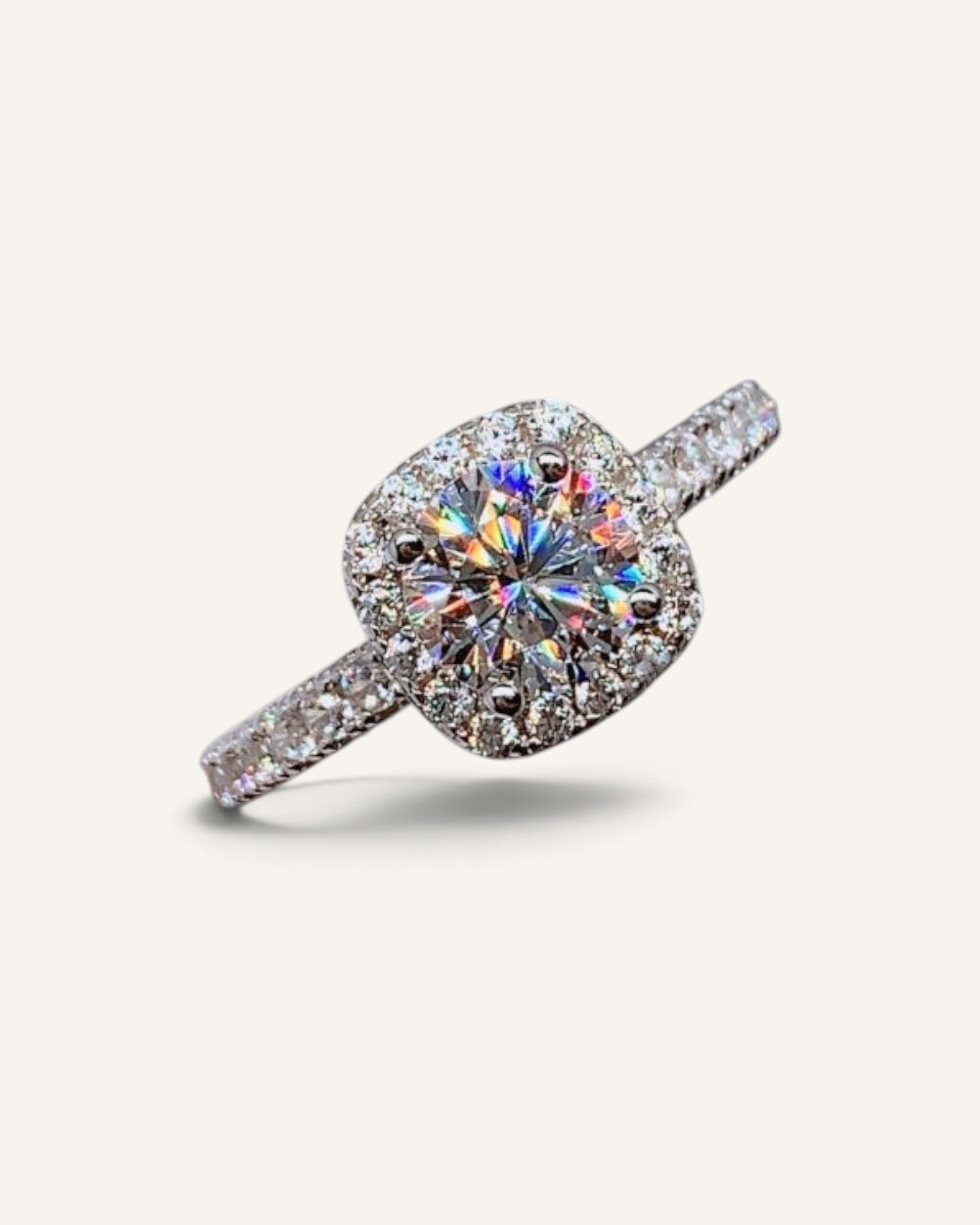 Lunéra de Paris round zircon halo solitaire ring with pavé accents on a silver band