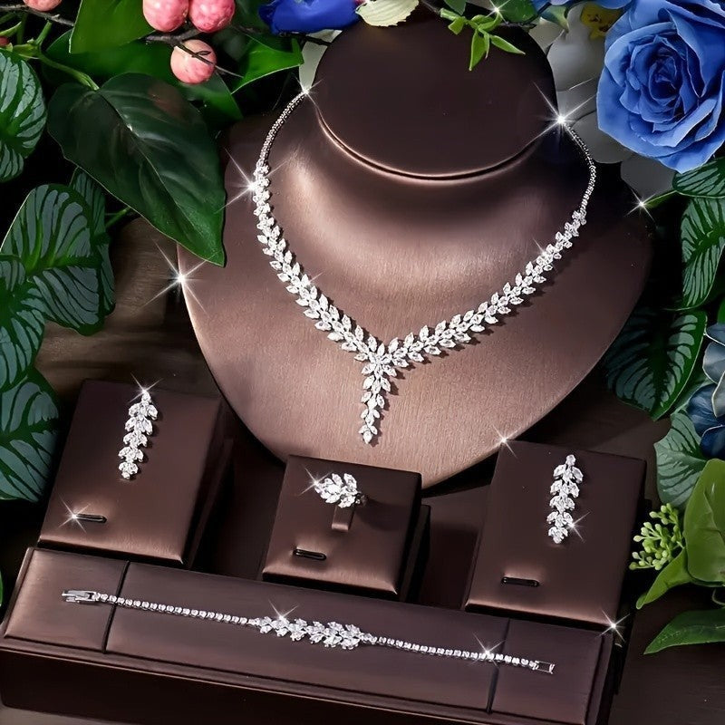 Lunéra de Paris 4-piece silver zircon jewelry set with marquise-cut leaf motifs on a display stand