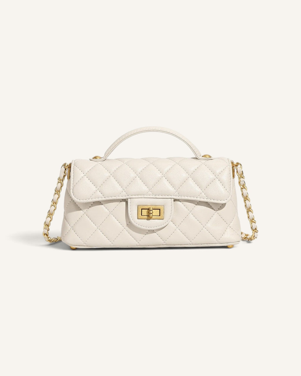 Lunéra de Paris white quilted mini shoulder bag with a structured flap, top handle, and gold chain-link strap.