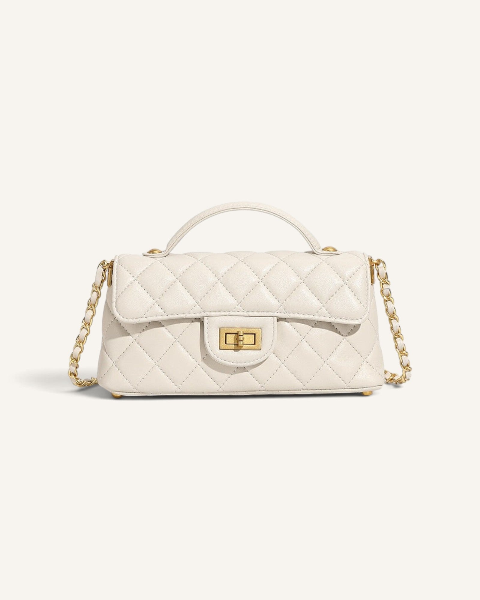 Lunéra de Paris white quilted mini shoulder bag with a structured flap, top handle, and gold chain-link strap.
