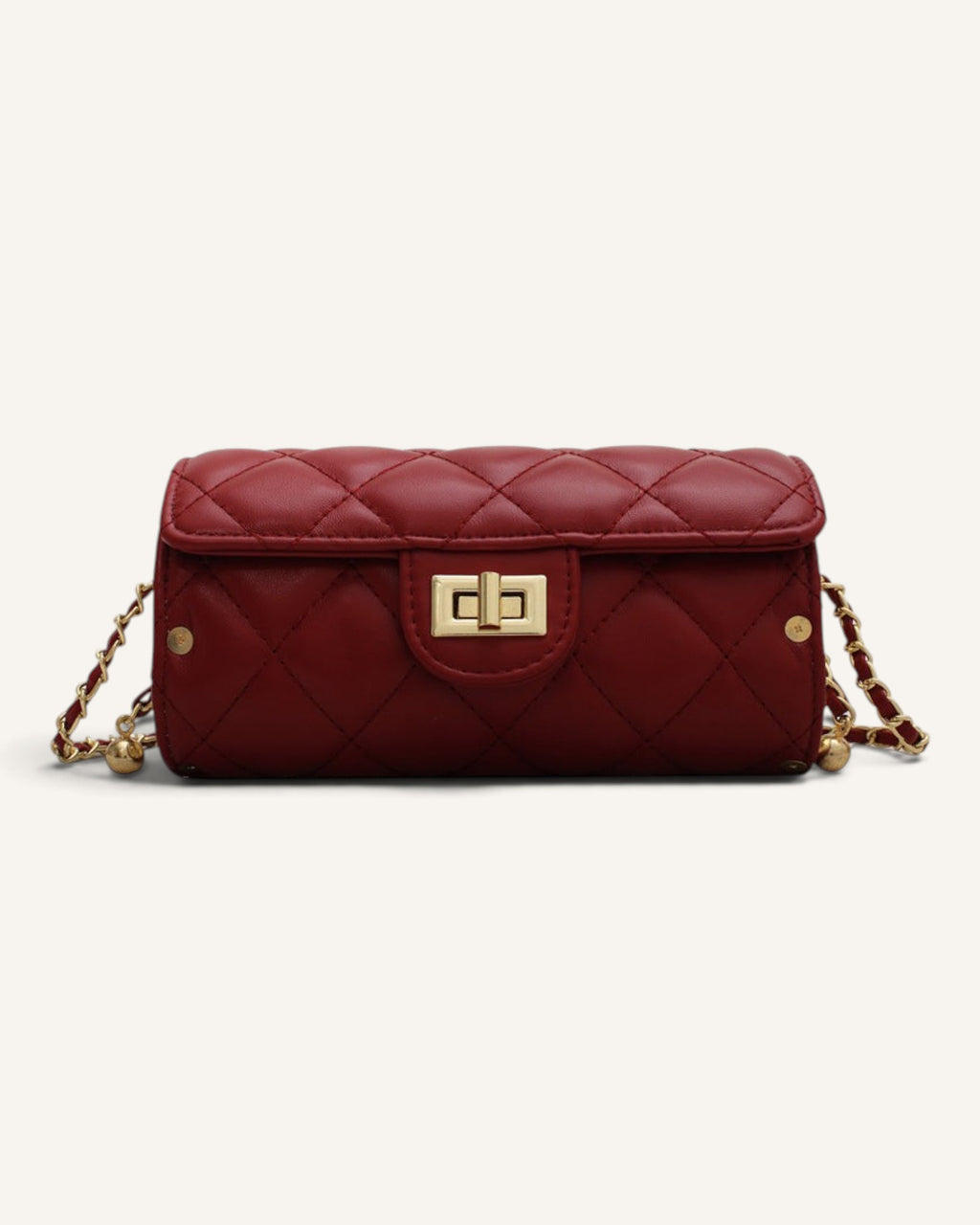 Lunéra de Paris wine red quilted cylindrical shoulder bag with gold chain strap and metal clasp