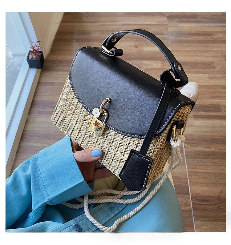 Lunéra de Paris woven crossbody bag with black flap, top handle, and floral charm turn-lock closure