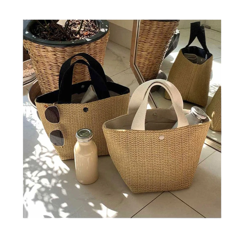 Lunéra de Paris Riviera woven bucket bags with black and white top handles for resort and casual summer styling