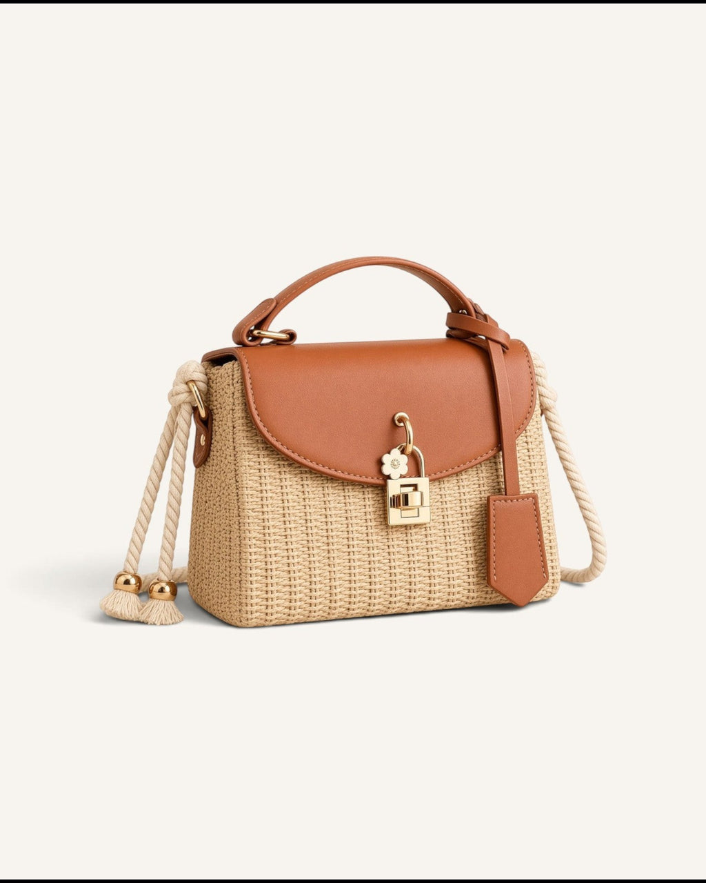 Lunéra de Paris woven crossbody bag in cognac brown with a top handle, rope strap, and floral turn-lock closure.