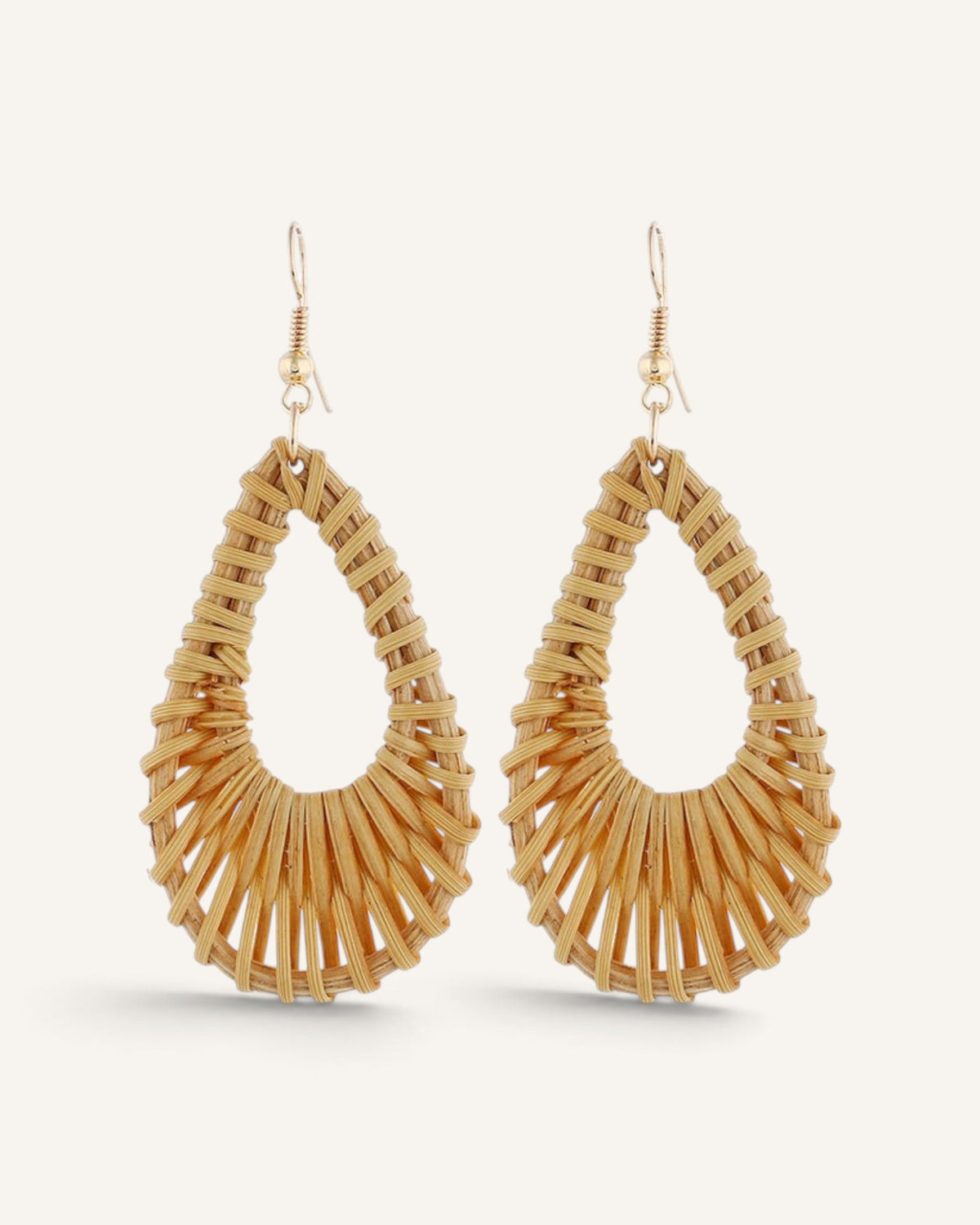 Lunéra de Paris woven rattan teardrop earrings with gold-tone hook closures on a light background