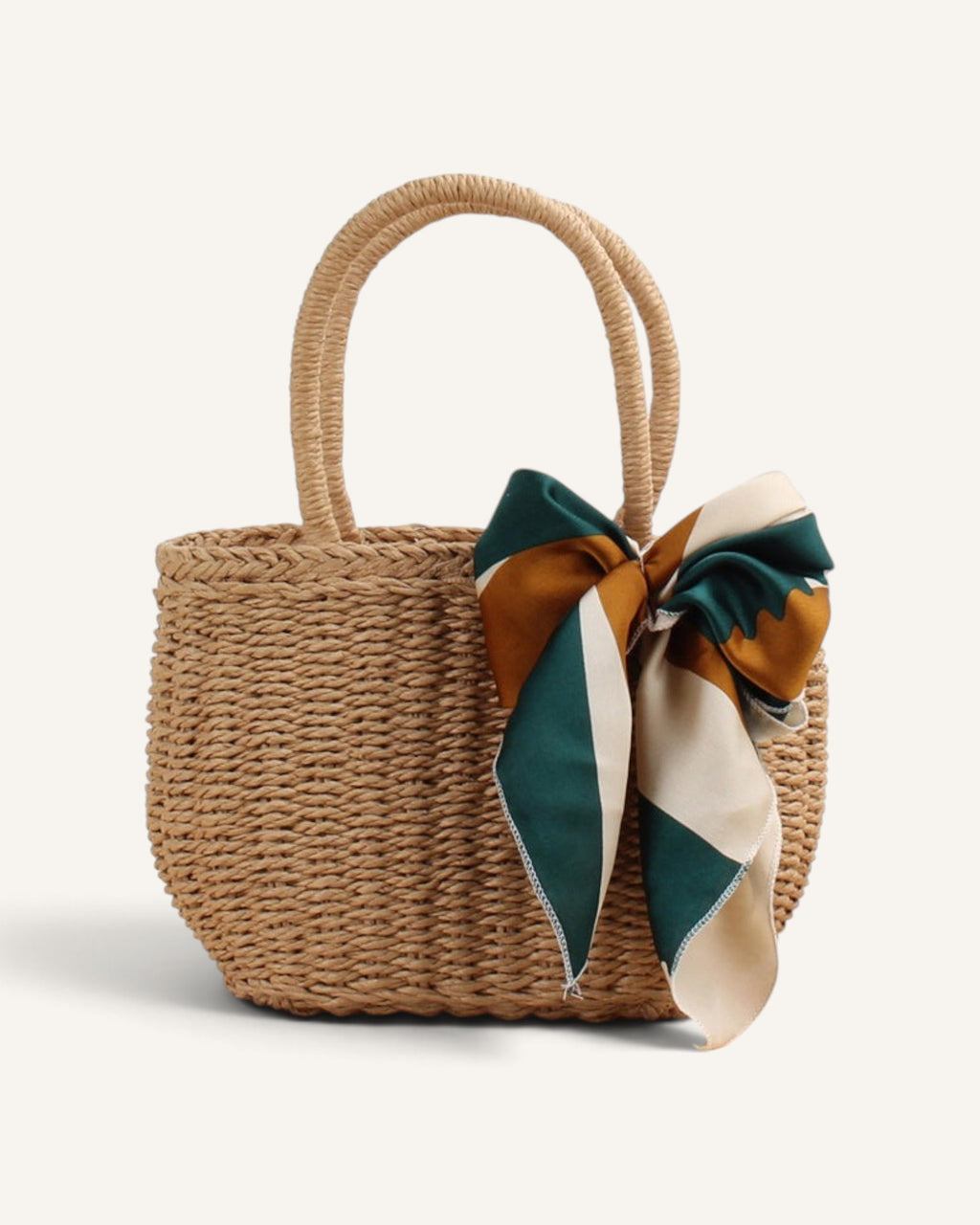 Lunéra de Paris beige woven straw-effect top-handle bag with a decorative green and gold patterned silk scarf