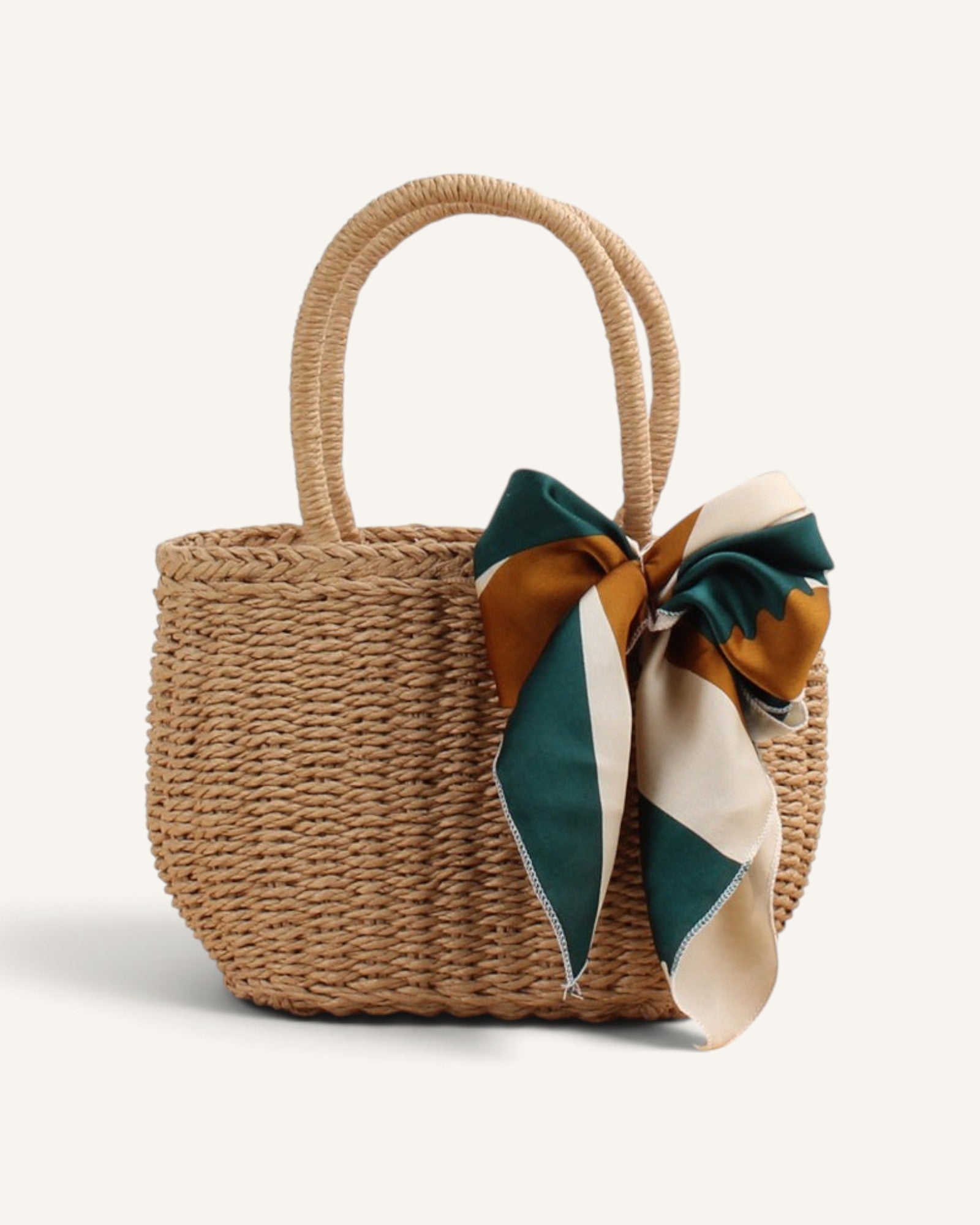 Lunéra de Paris beige woven straw-effect top-handle bag with a decorative green and gold patterned silk scarf