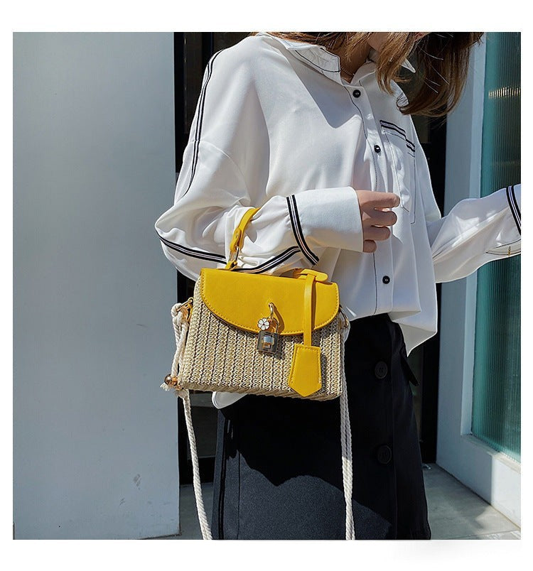 Lunéra de Paris yellow woven crossbody bag with top handle, rope strap, and floral charm worn by a woman