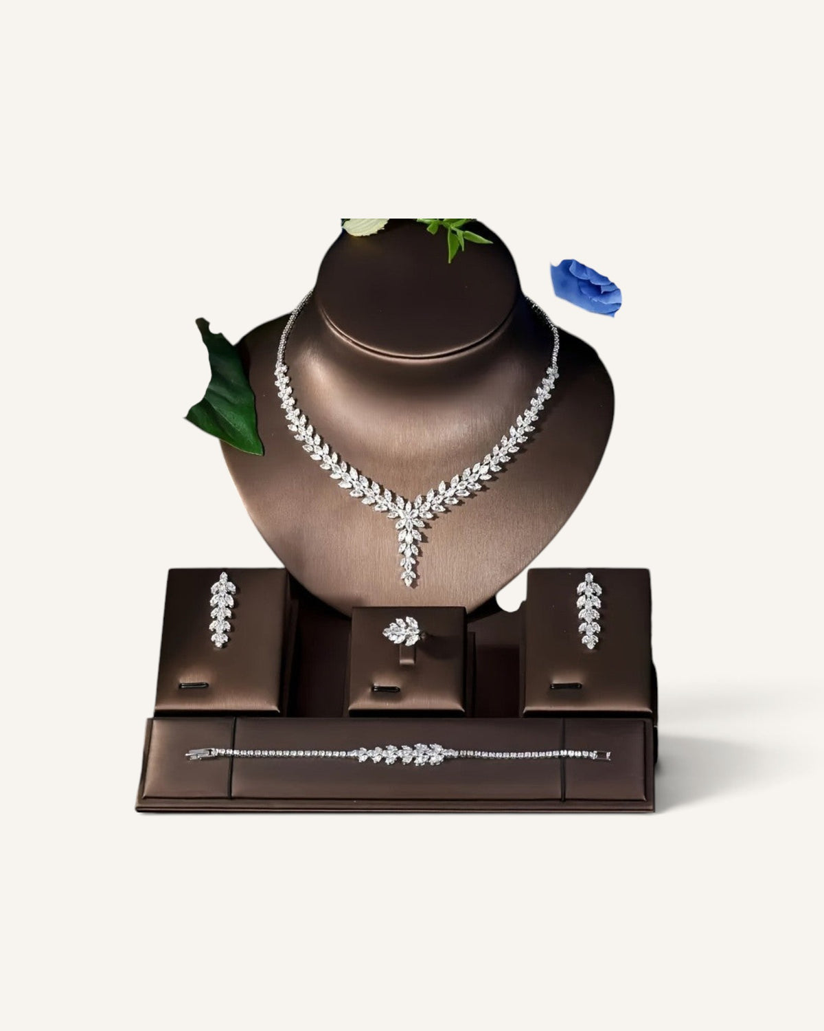 Lunéra de Paris 4-piece silver jewelry set with marquise-cut zircon stones in a botanical leaf and vine design.
